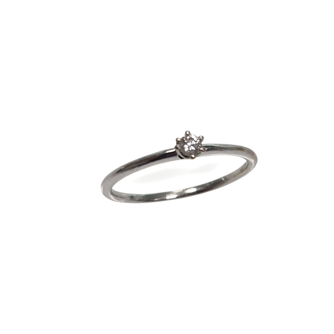 Bague blanc 1diamant environ 0.05ct